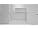 Spacious walk-in closet with built-in shelves at 2021 Se Twin Bridge Cir, Ocala, FL 34471
