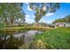 Beautiful community with pond and lush landscaping at 2021 Se Twin Bridge Cir, Ocala, FL 34471
