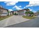 Single story home with driveway, landscaping, and attached garage at 2021 Se Twin Bridge Cir, Ocala, FL 34471