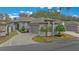 Single-story home with attached garage and landscaped yard at 2021 Se Twin Bridge Cir, Ocala, FL 34471