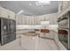 Modern kitchen featuring granite countertops and stainless steel appliances at 2021 Se Twin Bridge Cir, Ocala, FL 34471