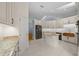 Updated kitchen with granite counters and white cabinets at 2021 Se Twin Bridge Cir, Ocala, FL 34471
