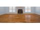 Living room with hardwood floors and a fireplace at 2021 Se Twin Bridge Cir, Ocala, FL 34471