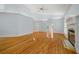 Bright living room featuring hardwood floors and a fireplace at 2021 Se Twin Bridge Cir, Ocala, FL 34471