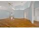 Open living room with hardwood floors and vaulted ceilings at 2021 Se Twin Bridge Cir, Ocala, FL 34471
