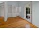 Home office with built-in shelving and hardwood floors at 2021 Se Twin Bridge Cir, Ocala, FL 34471