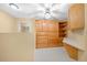Upstairs office with built-in wooden cabinets and desk at 2021 Se Twin Bridge Cir, Ocala, FL 34471