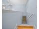 Elegant staircase leading downstairs, light blue walls at 2021 Se Twin Bridge Cir, Ocala, FL 34471