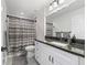 The bathroom includes a single sink vanity and a shower/tub combo at 205 Brevard Ave, Lady Lake, FL 32159