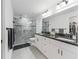Modern bathroom featuring a glass enclosed shower and double sink vanity at 205 Brevard Ave, Lady Lake, FL 32159