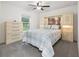 This bedroom features an art niche above the bed and a window to the outside at 205 Brevard Ave, Lady Lake, FL 32159