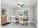 Light filled dining room with modern lighting, a wooden table, and views of the yard at 205 Brevard Ave, Lady Lake, FL 32159