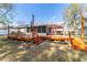 View of a backyard with patio, deck and seating area at 2412 Se 23Rd Pl, Ocala, FL 34471