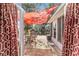 View of screened-in porch, patio and table and chairs, with privacy curtain at 2412 Se 23Rd Pl, Ocala, FL 34471