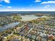 Aerial view of home near lake and golf course at 2997 Teasdale Ter, The Villages, FL 32163