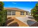 Home exterior and backyard with a spacious patio area at 2997 Teasdale Ter, The Villages, FL 32163