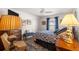 Guest bedroom with a queen-size bed and lovely decor at 2997 Teasdale Ter, The Villages, FL 32163