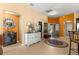 Bright entryway with decorative furniture and accent wall at 2997 Teasdale Ter, The Villages, FL 32163