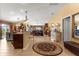 Open concept entryway, looking towards the kitchen and living areas at 2997 Teasdale Ter, The Villages, FL 32163