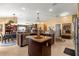 Open kitchen with breakfast bar, granite countertops, and stainless steel appliances at 2997 Teasdale Ter, The Villages, FL 32163