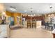 Open concept kitchen and living area with hardwood floors at 2997 Teasdale Ter, The Villages, FL 32163