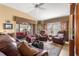 Relaxing living room with comfortable leather furniture and a cozy atmosphere at 2997 Teasdale Ter, The Villages, FL 32163