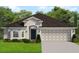 Traditional home with a gray color scheme, complemented by a two-car garage and well-manicured landscaping at 3168 Ne 46Th Ave, Ocala, FL 34470