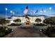 Hotel plaza with statues, benches, and flags creating an elegant and welcoming space at 3168 Ne 46Th Ave, Ocala, FL 34470