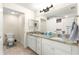 Double vanity bathroom with granite countertop and a large mirror at 3707 Se 24Th St, Ocala, FL 34471