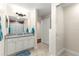 Bathroom with granite countertop and a large mirror at 3707 Se 24Th St, Ocala, FL 34471