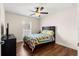Bedroom with hardwood floors, window, and ceiling fan at 3707 Se 24Th St, Ocala, FL 34471