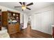 Bedroom with hardwood floors and built-in wooden storage at 3707 Se 24Th St, Ocala, FL 34471