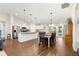 Open concept kitchen and dining area with hardwood floors at 3707 Se 24Th St, Ocala, FL 34471