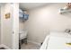 Laundry room with utility sink and shelving at 3707 Se 24Th St, Ocala, FL 34471
