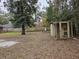 The backyard is heavily wooded and includes a chicken coop, storage area, and open space at 3752 Se 130Th St, Belleview, FL 34420