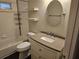 Bathroom showcasing a vanity with granite countertop, bathtub-shower combo, and tile flooring at 3752 Se 130Th St, Belleview, FL 34420
