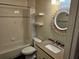 Bathroom featuring granite countertop vanity, decorative mirror, tile flooring, and shower-tub combo at 3752 Se 130Th St, Belleview, FL 34420