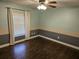 Bedroom with a two-tone paint scheme, laminate flooring, and natural light at 3752 Se 130Th St, Belleview, FL 34420