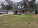 Front view of a one-story house with a grassy yard at 3752 Se 130Th St, Belleview, FL 34420