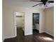 Main bedroom featuring a walk-in closet and an ensuite bathroom at 3752 Se 130Th St, Belleview, FL 34420