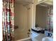 Bright bathroom with shower/tub and patterned curtain at 3915 Sw 139Th Street Rd, Ocala, FL 34473