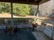 Spacious screened porch with seating at 3915 Sw 139Th Street Rd, Ocala, FL 34473