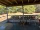 Relaxing screened porch with patio furniture at 3915 Sw 139Th Street Rd, Ocala, FL 34473