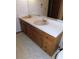 Bathroom with double vanity and wood cabinets at 4960 Se 17Th St, Ocala, FL 34471