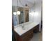 Double vanity with wood cabinets in this bathroom at 4960 Se 17Th St, Ocala, FL 34471