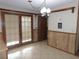 Bright dining area with wood paneling and tiled floors at 4960 Se 17Th St, Ocala, FL 34471