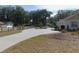 Long driveway leading to a house with landscaping at 4960 Se 17Th St, Ocala, FL 34471