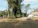 Ranch-style home with a large yard and mature trees at 4960 Se 17Th St, Ocala, FL 34471