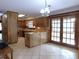 Kitchen with wood cabinets, breakfast bar, and access to patio at 4960 Se 17Th St, Ocala, FL 34471