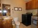Laundry room with washer, dryer, sink, and cabinets at 4960 Se 17Th St, Ocala, FL 34471